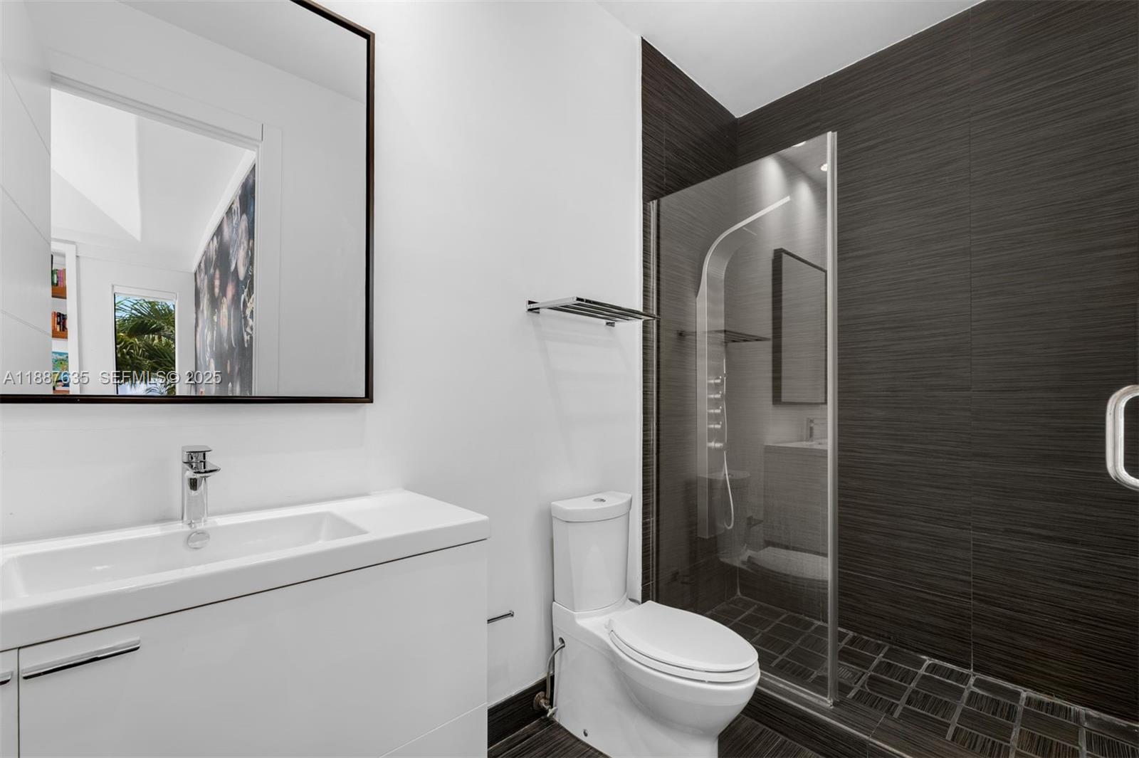 330 Caribbean Road Key Biscayne, FL 33149 - Photo 27 of 46 a bathroom with a toilet sink and shower