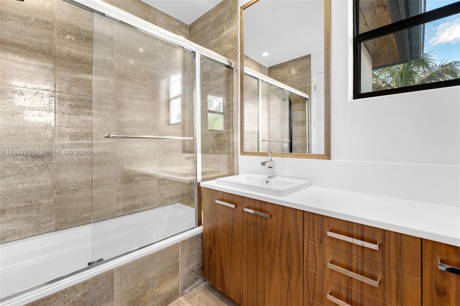 330 Caribbean Road Key Biscayne, FL 33149 - Photo 30 of 46 a bathroom with a bathtub and a sink