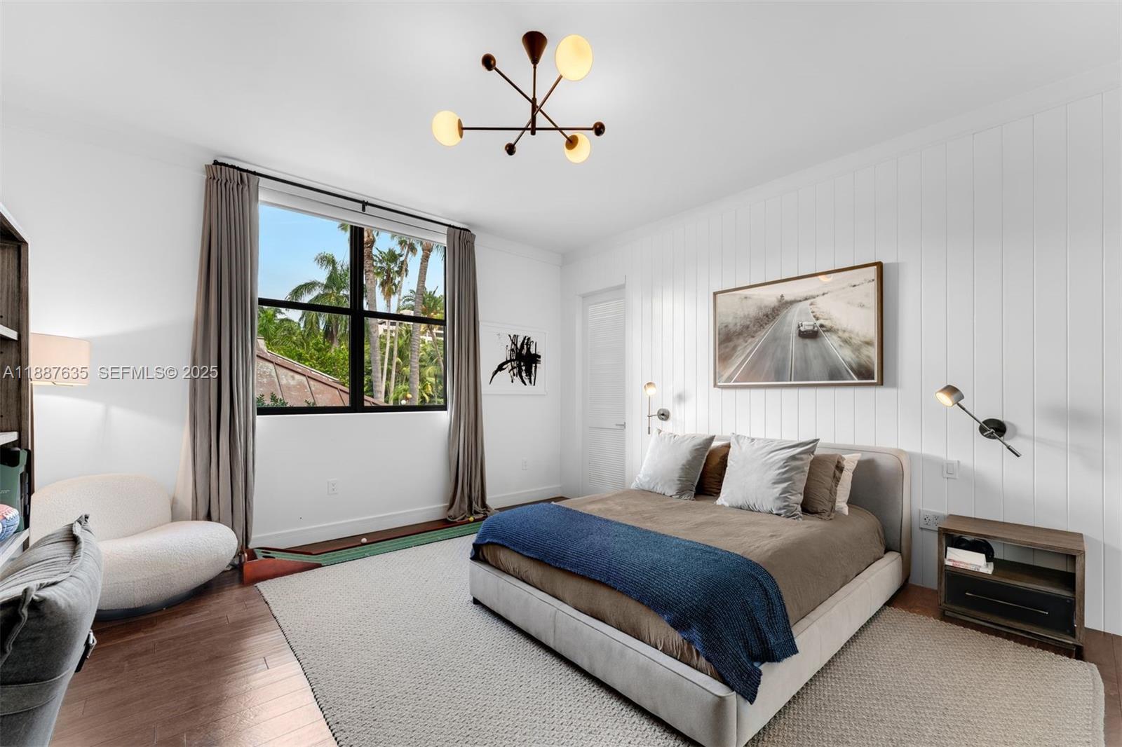 330 Caribbean Road Key Biscayne, FL 33149 - Photo 32 of 46 a bedroom with a large bed and a window