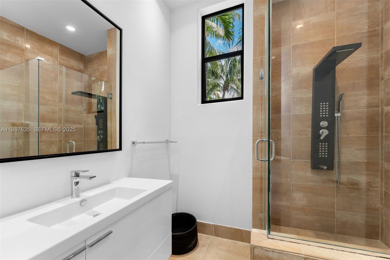 330 Caribbean Road Key Biscayne, FL 33149 - Photo 35 of 46 a bathroom with a sink and a mirror