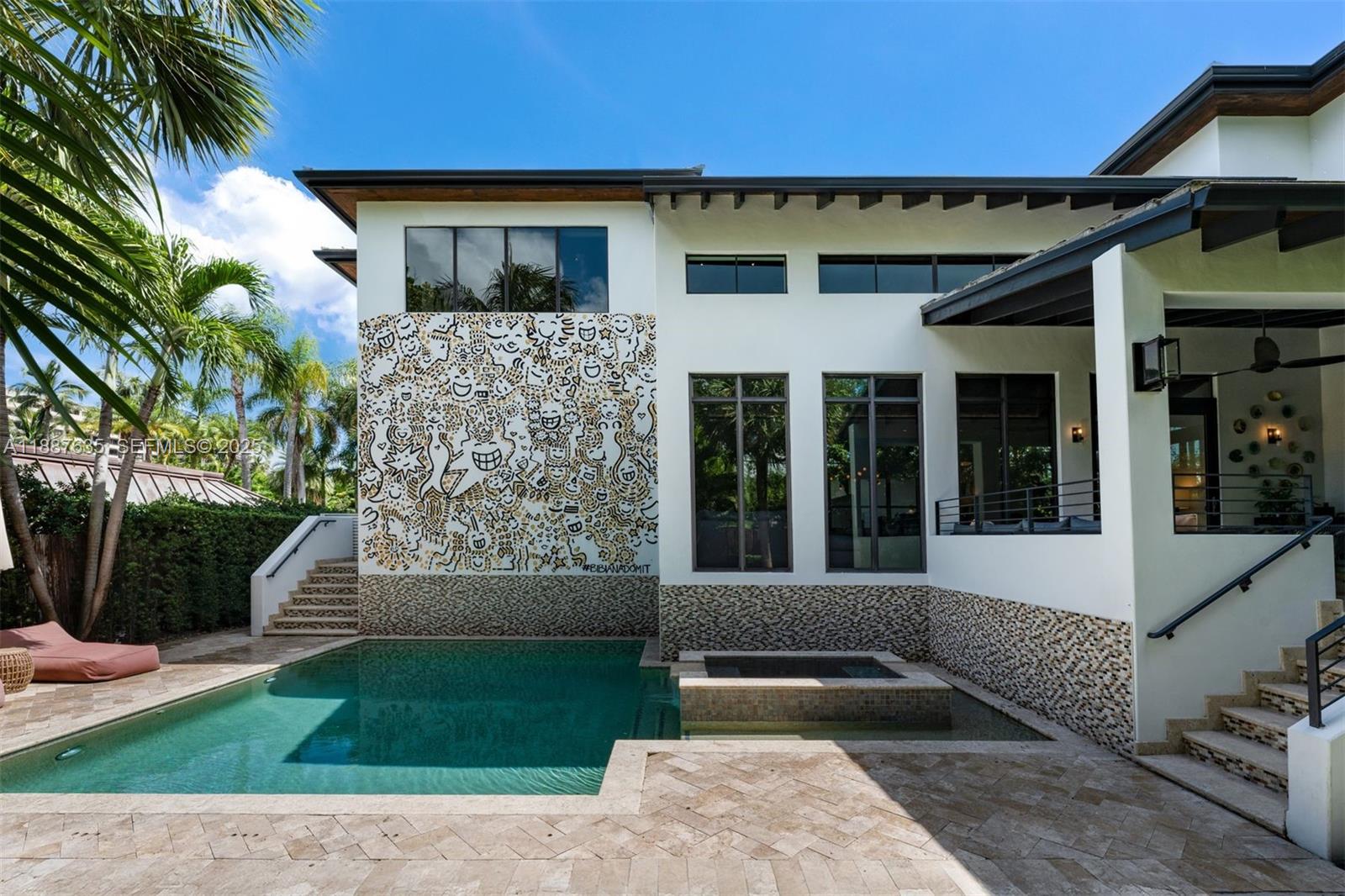 330 Caribbean Road Key Biscayne, FL 33149 - Photo 40 of 46 a front view of a house with a yard