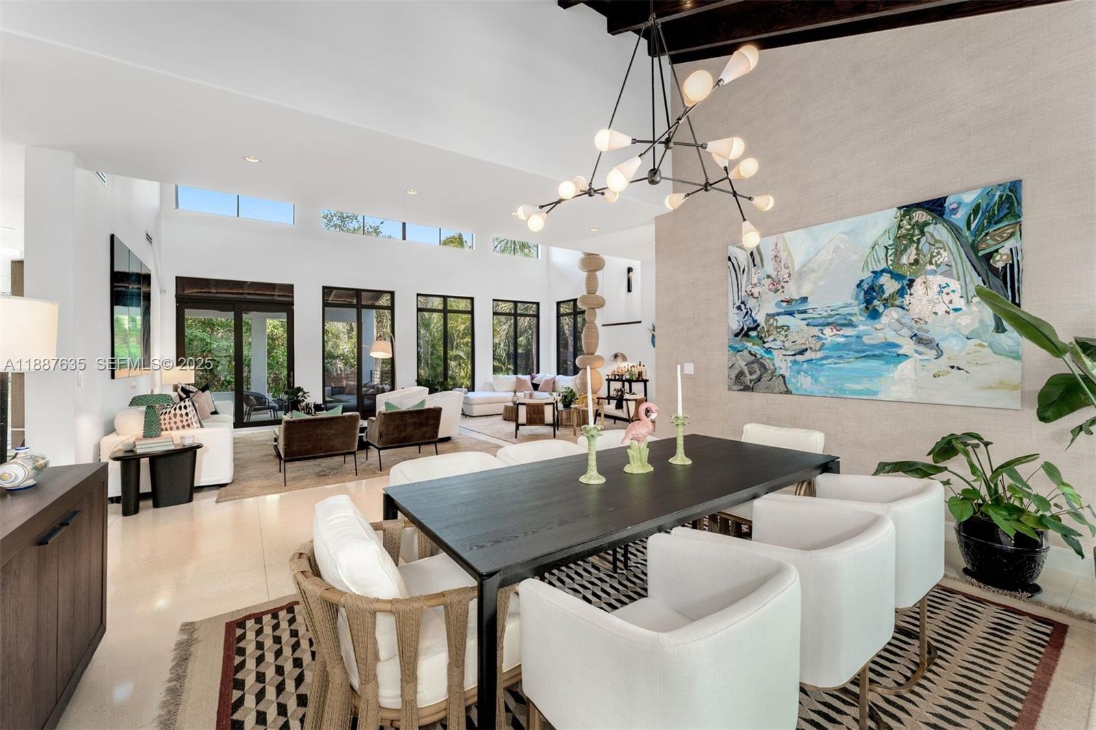 330 Caribbean Road Key Biscayne, FL 33149 - Photo 7 of 46 a living room with furniture a chandelier and a table
