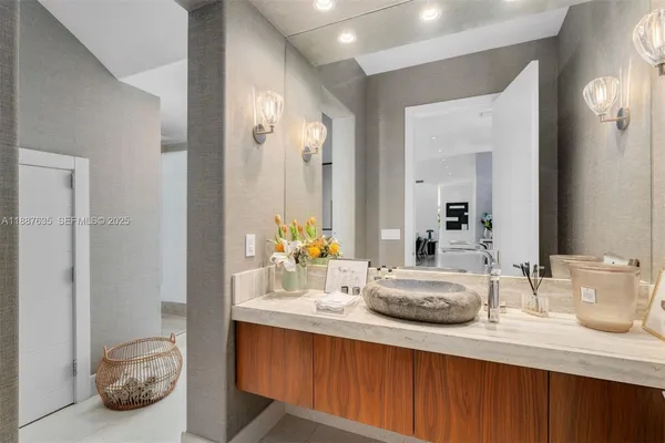 a bathroom with a sink double vanity and a mirror