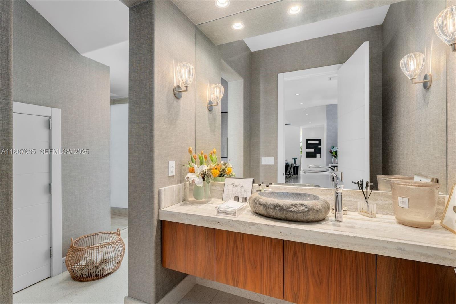 330 Caribbean Road Key Biscayne, FL 33149 - Photo 10 of 46 a bathroom with a sink double vanity and a mirror