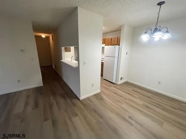 a view of a livingroom with wooden floor