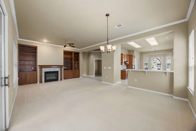 a view of a kitchen with a sink and cabinet