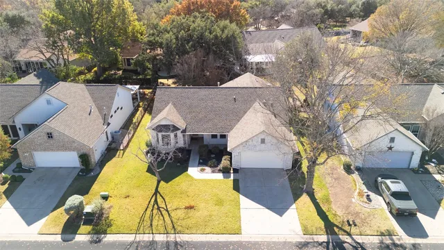 an aerial view of a house with swimming pool