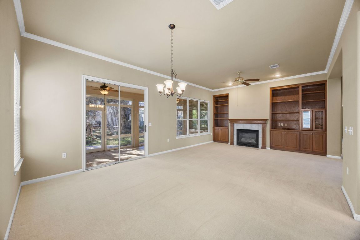 104 Lariat Drive Georgetown, TX 78633 - Photo 7 of 35 cozy fireplace and warm built ins