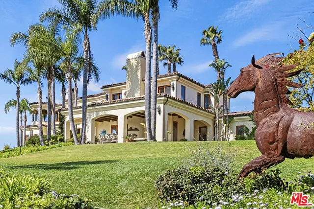 a view of swimming pool with a yard and seating area