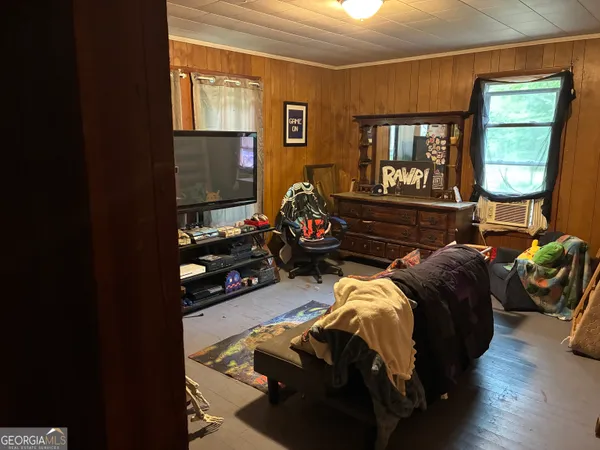 a bedroom with two beds and a window