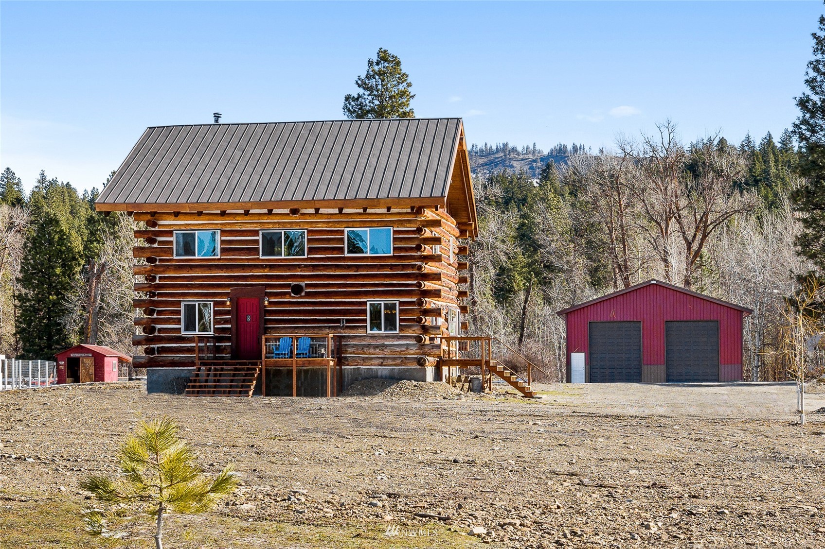 170 Quail Valley Road Cle Elum, WA 98922 - Photo 1 of 40 a front view of a house with a yard