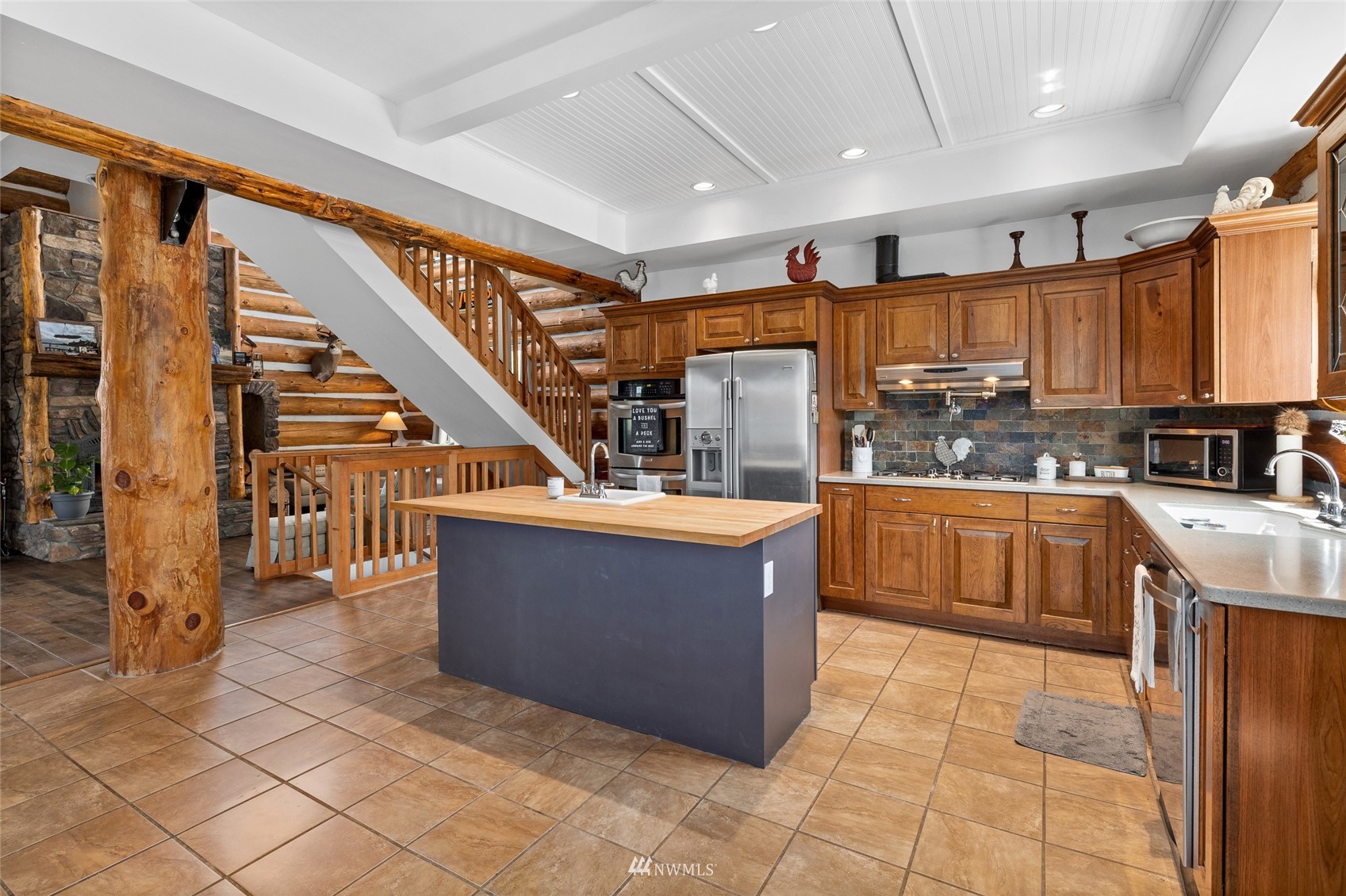 170 Quail Valley Road Cle Elum, WA 98922 - Photo 13 of 40 a kitchen with stainless steel appliances granite countertop a stove a sink and a refrigerator