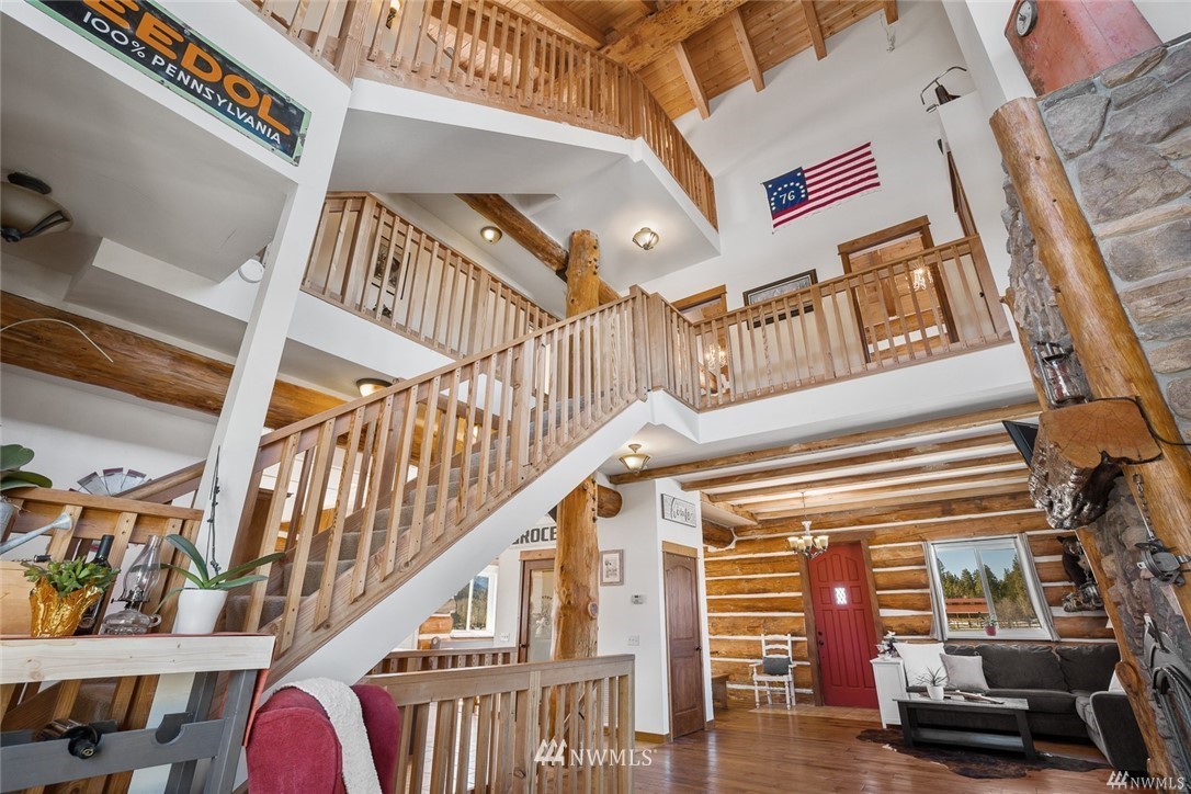 170 Quail Valley Road Cle Elum, WA 98922 - Photo 17 of 40 a view of staircase with lots of frames on wall and windows