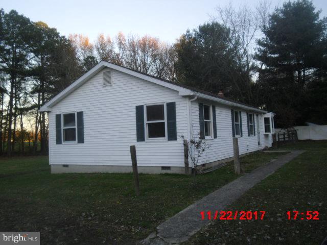 30858 Rabbit Hill Road Cordova, MD 21625 - Photo 3 of 8 a front view of a house with a garden and yard