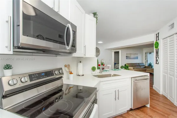 a kitchen with a stove and a microwave