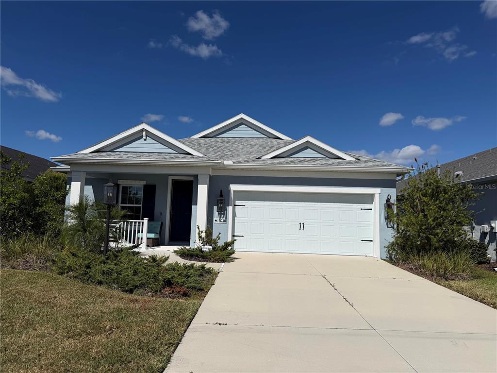 10710 Falling Leaf Court Parrish, FL 34219 - Photo 1 of 28 a front view of a house with garden