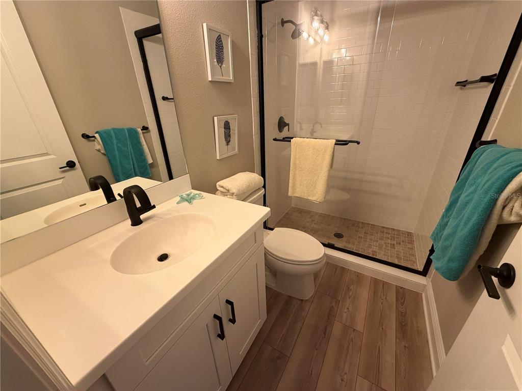 10710 Falling Leaf Court Parrish, FL 34219 - Photo 22 of 28 a bathroom with a sink and a toilet
