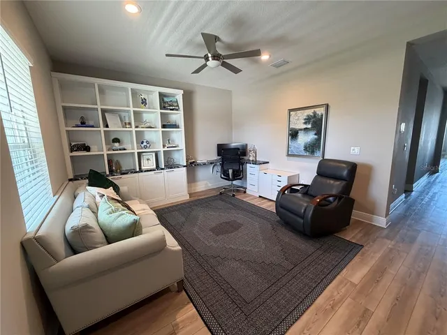 a living room with furniture and a rug
