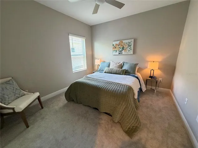 a bedroom with a bed and window