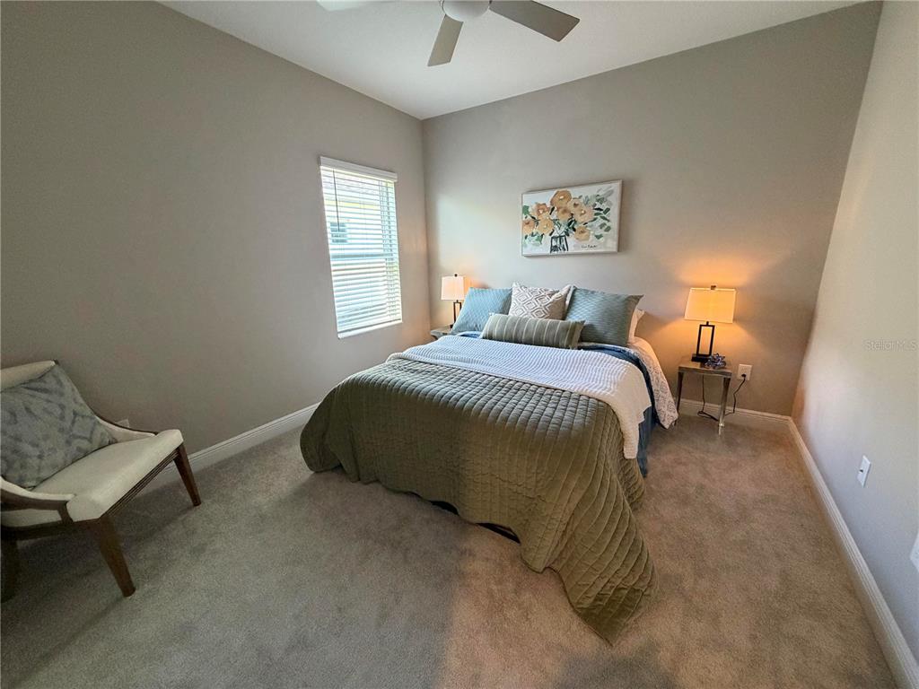 10710 Falling Leaf Court Parrish, FL 34219 - Photo 7 of 28 a bedroom with a bed and window