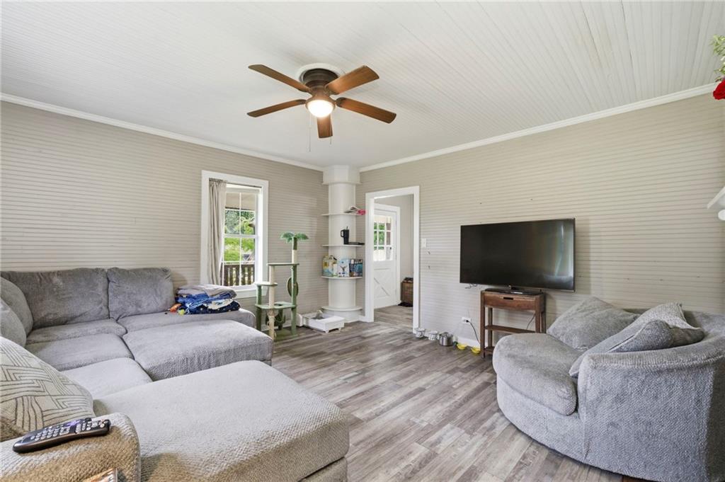 400 Sam Love Road Rocky Face, GA 30740 - Photo 11 of 29 a living room with furniture and a flat screen tv