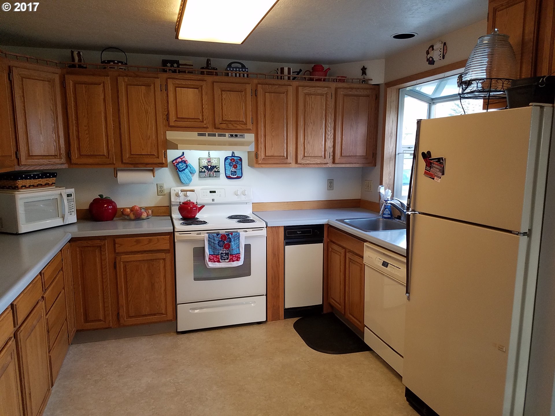 2218 Southwest Quinney Drive Pendleton, OR 97801 - Photo 8 of 32 a kitchen with stainless steel appliances granite countertop a refrigerator and a stove top oven
