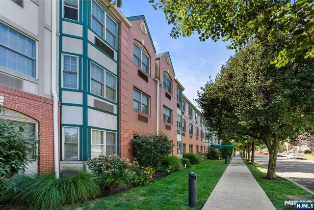 a view of a building with a yard