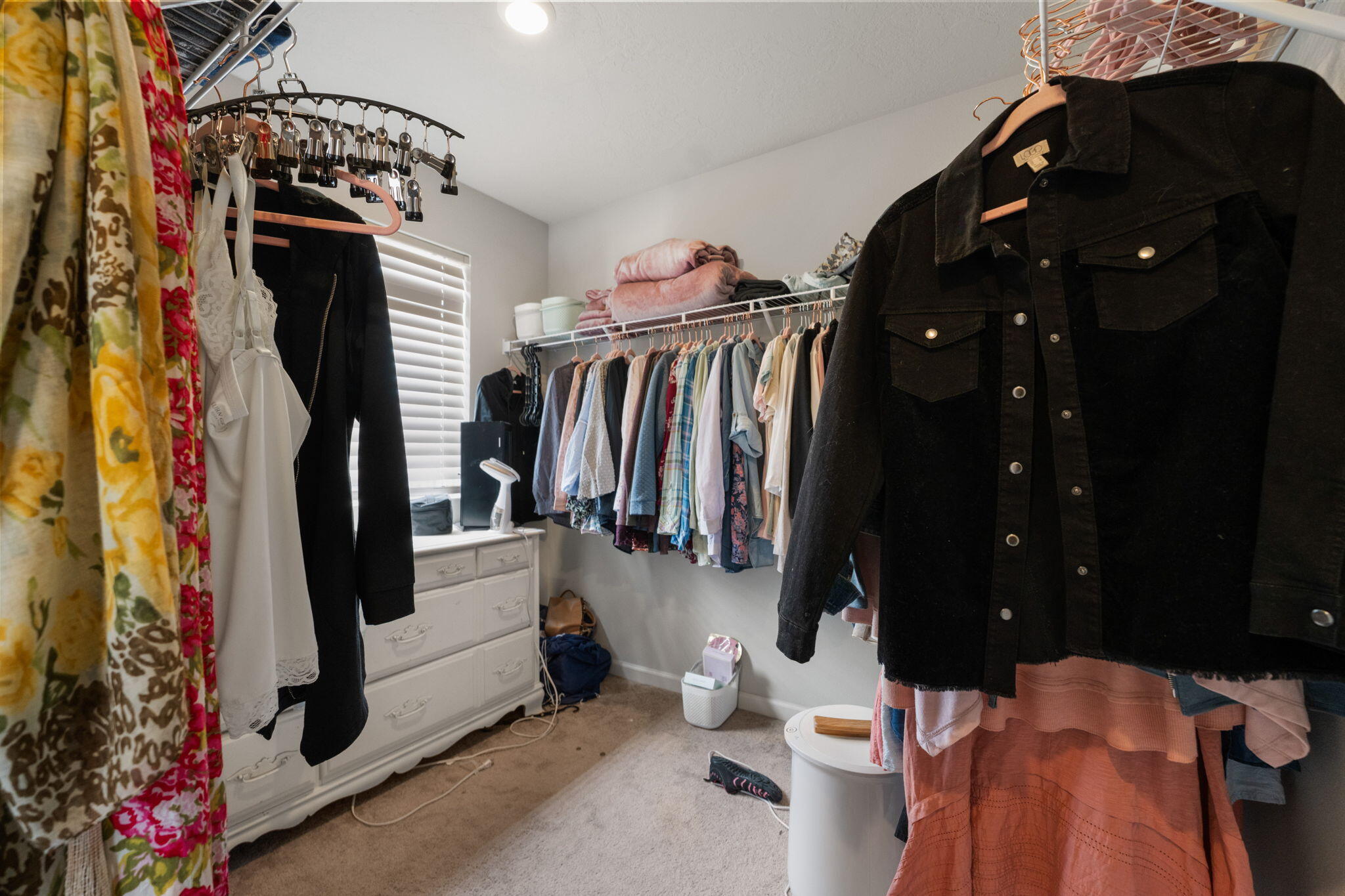 4039 Southwest Quartz Place Redmond, OR 97756 - Photo 39 of 44 a view of walk in closet with clothes and shoes