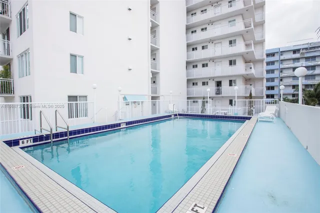 a view of a swimming pool with a balcony