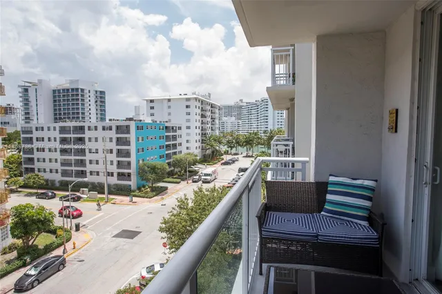 a view of balcony with furniture
