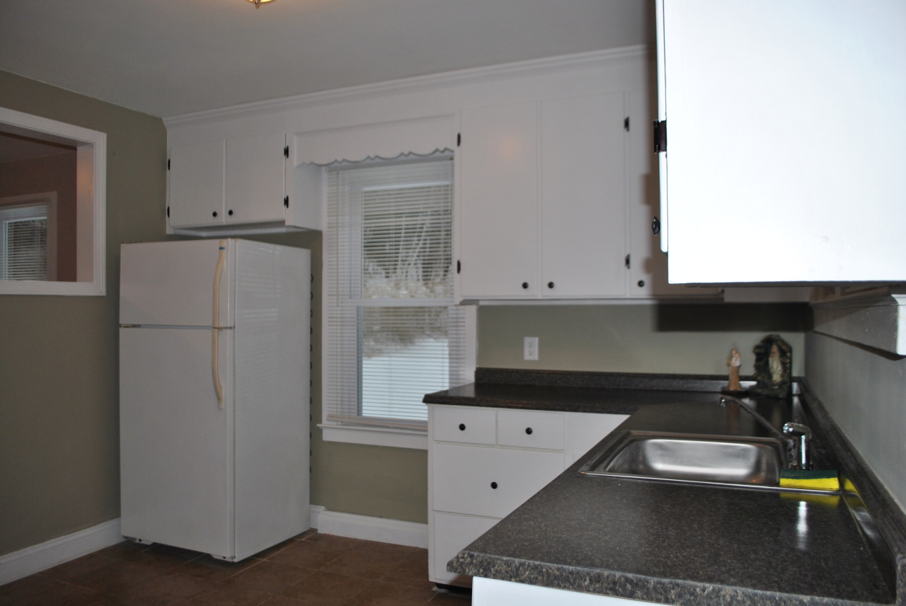 882 Savoy Road Cheshire, MA 01225 - Photo 14 of 27 a kitchen with a refrigerator and a sink