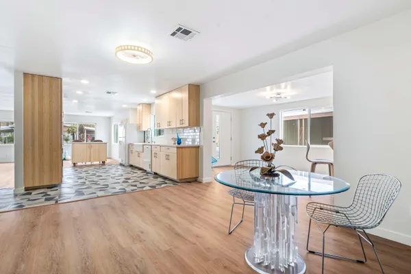 a kitchen with granite countertop cabinets and steel stainless steel appliances