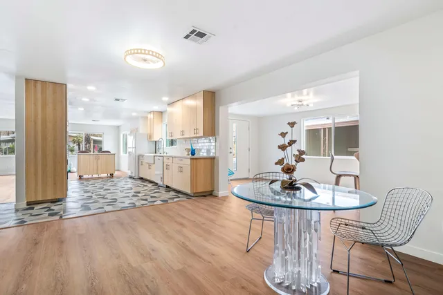 a kitchen with granite countertop cabinets and steel stainless steel appliances