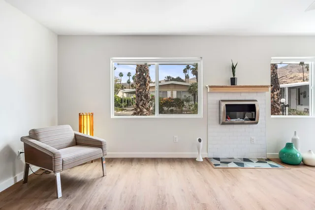 a view of a livingroom with furniture and a window