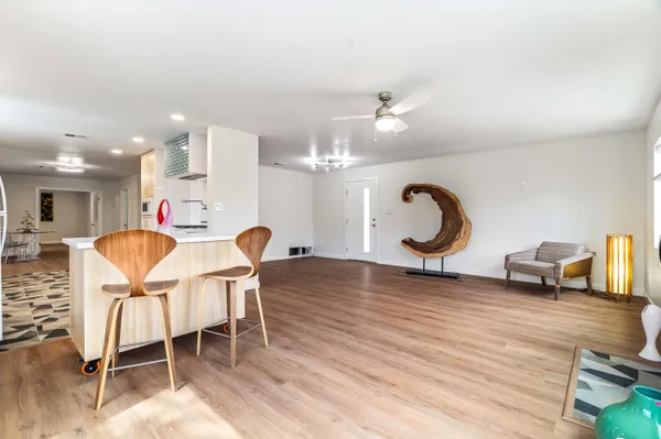 a view of a living room and a wooden floor