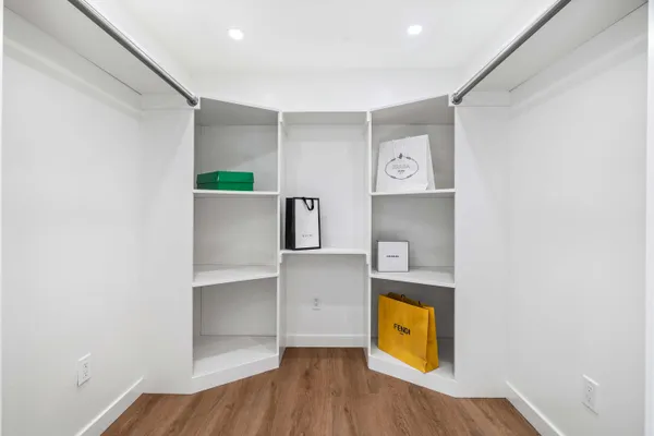 a bathroom with a shower and a glass door