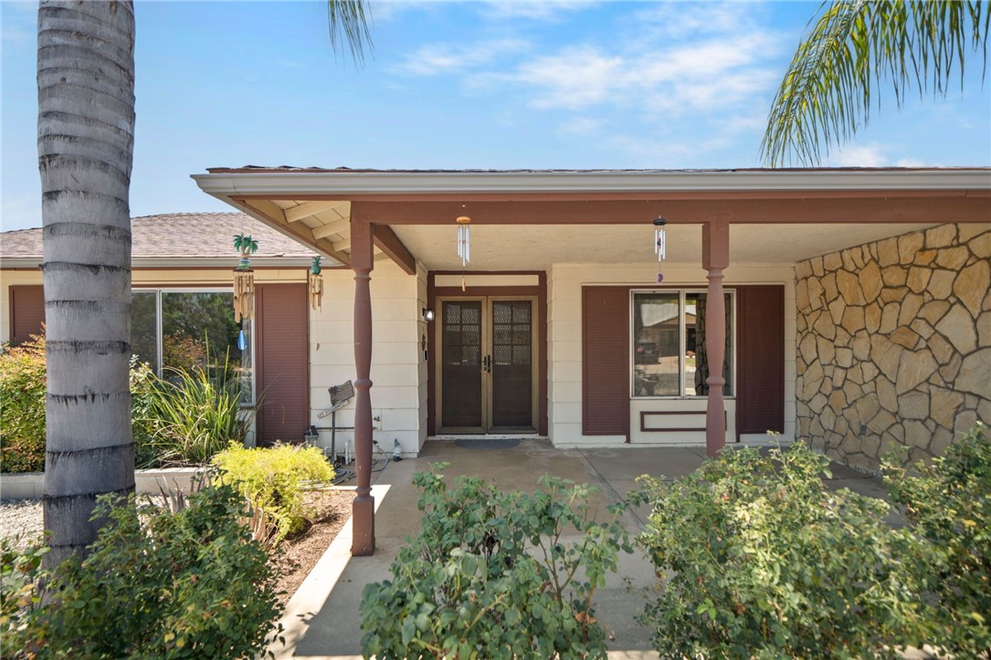 27879 Foxfire Street Menifee, CA 92586 - Photo 7 of 36 front view of a house with a small yard
