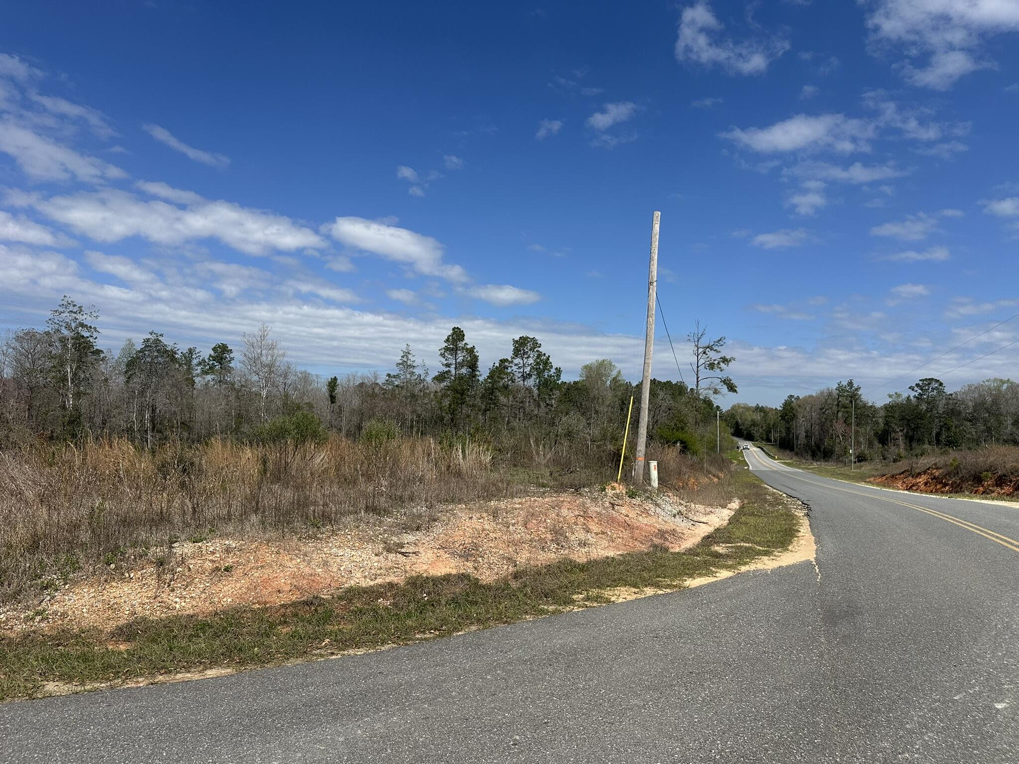 Tract#6409 Davis Road, Unit RIVER ROAD Caryville, FL 32427 - Photo 5 of 12 a view of a lake with a house in the background