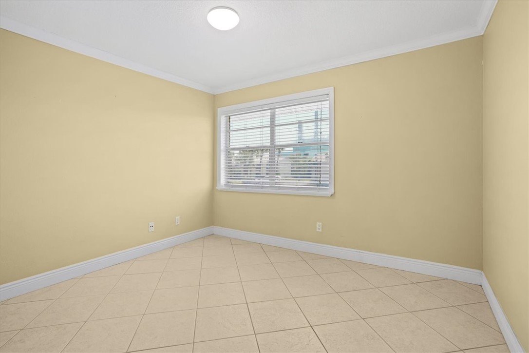 1845 Robalo Drive, Unit 201D Vero Beach, FL 32960 - Photo 18 of 35 an empty room with windows