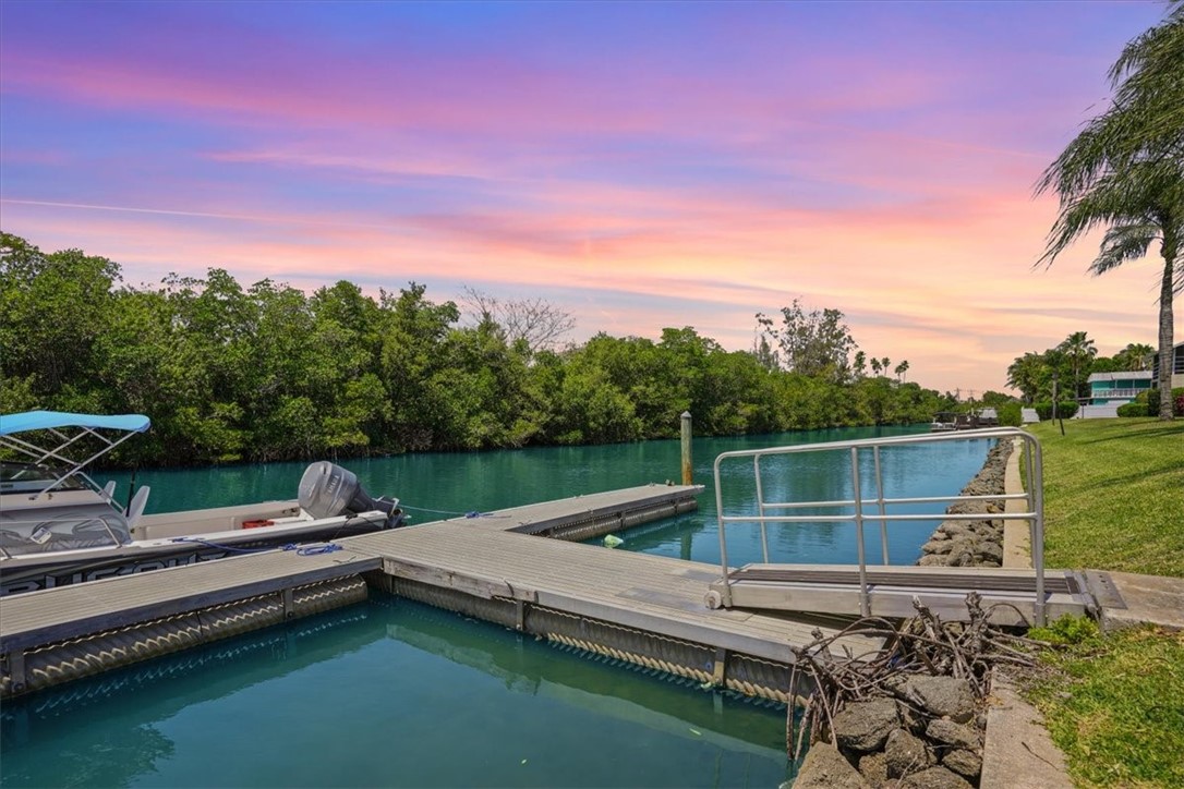 1845 Robalo Drive, Unit 201D Vero Beach, FL 32960 - Photo 25 of 35 a garden view with a lake view