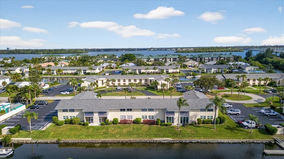 1845 Robalo Drive, Unit 201D Vero Beach, FL 32960 - Photo 32 of 35 an aerial view of residential houses with outdoor space