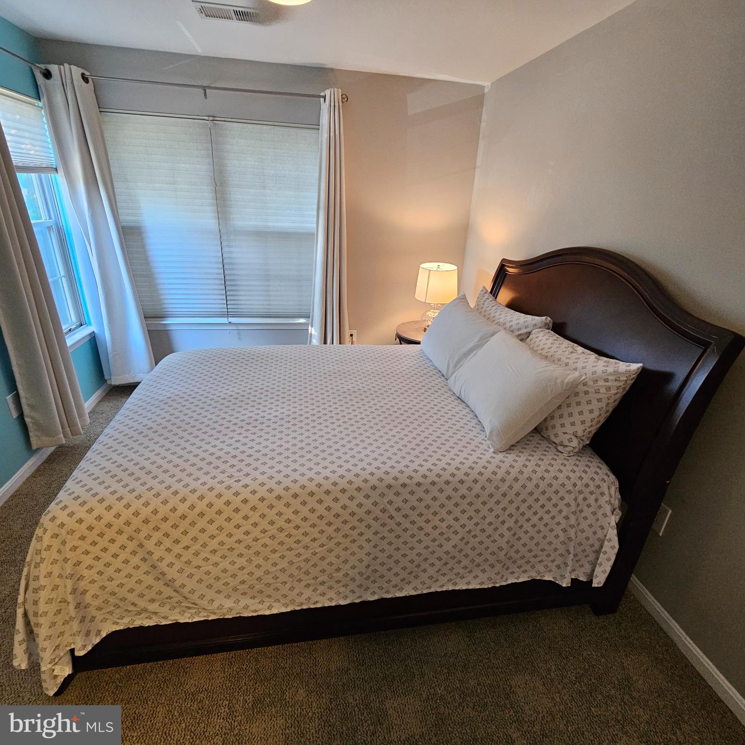 8637 D Beekman Place, Unit 37D Alexandria, VA 22309 - Photo 12 of 18 a bedroom with a bed and a mirror
