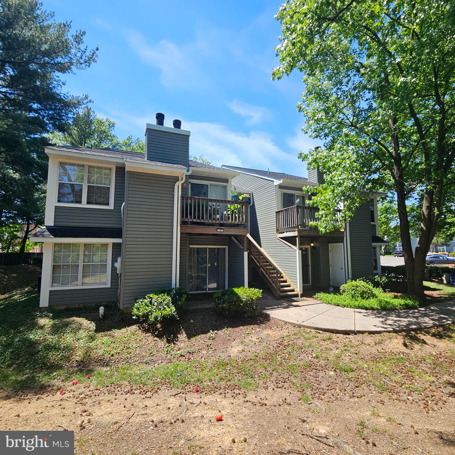 8637 D Beekman Place, Unit 37D Alexandria, VA 22309 - Photo 16 of 18 a front view of a house with garden