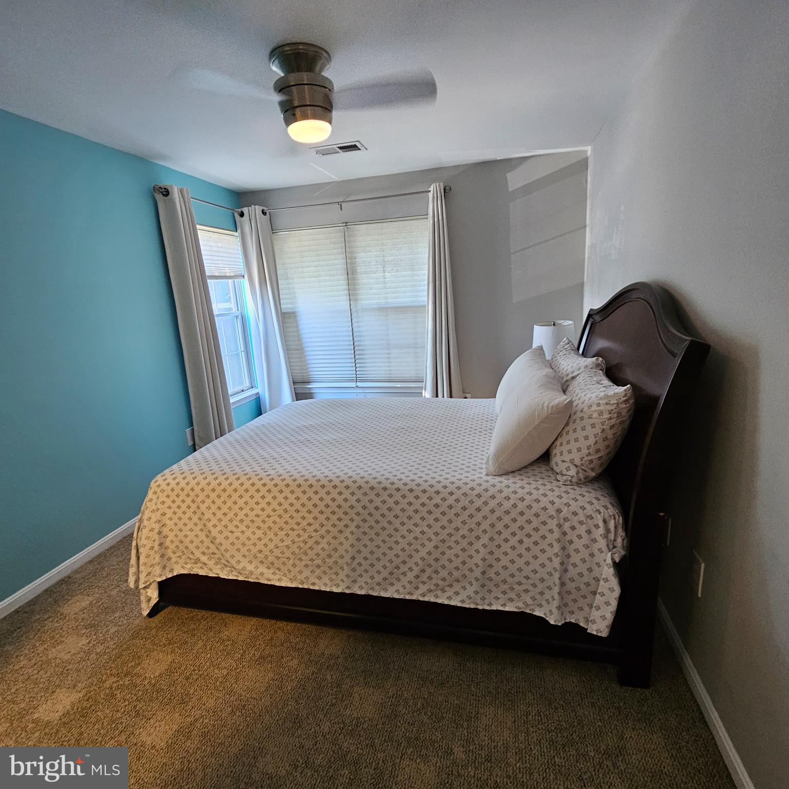 8637 D Beekman Place, Unit 37D Alexandria, VA 22309 - Photo 10 of 18 a bedroom with a bed a window and dresser