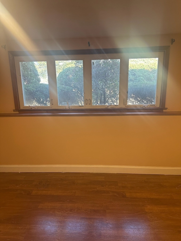 4 Gallagher Drive, Unit 1 Randolph, MA 02368 - Photo 4 of 9 a view of a room with wooden floor and a window