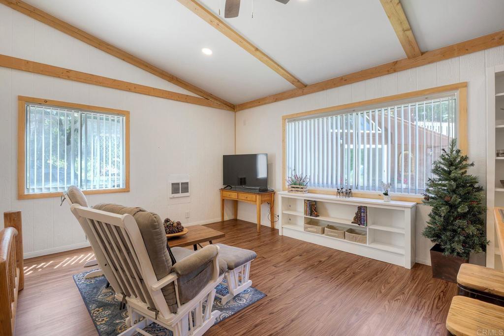 22223 Crestline Road Palomar Mountain, CA 92060 - Photo 31 of 90 a living room with furniture a flat screen tv and wooden floor