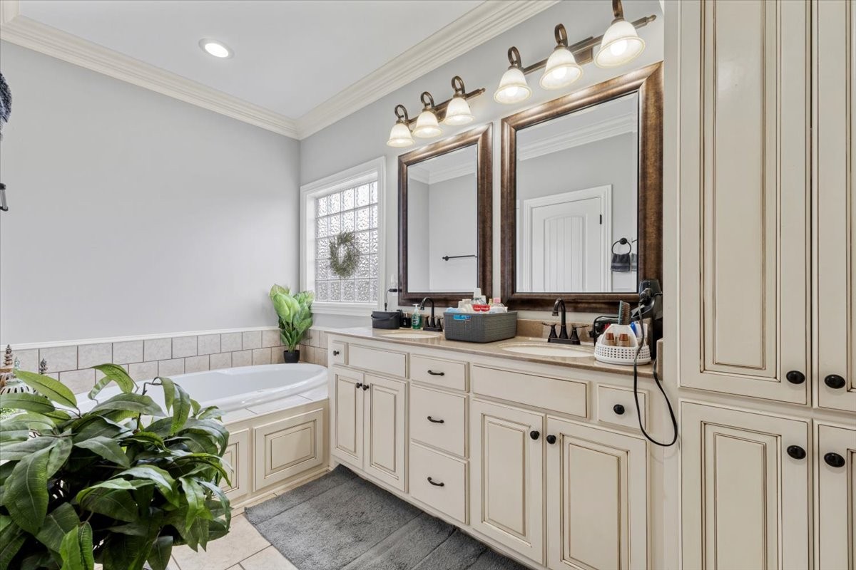 106 Riley Creek Road Tullahoma, TN 37388 - Photo 13 of 25 a spacious bathroom with a double vanity sink and a mirror