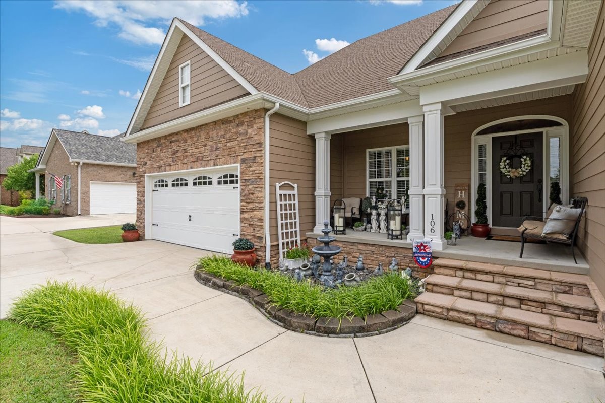 106 Riley Creek Road Tullahoma, TN 37388 - Photo 2 of 25 a front view of a house with garden