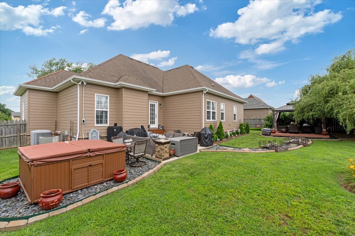 106 Riley Creek Road Tullahoma, TN 37388 - Photo 22 of 25 a front view of house with yard and outdoor seating