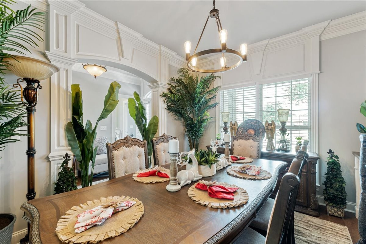 106 Riley Creek Road Tullahoma, TN 37388 - Photo 4 of 25 a view of a dining room with furniture a chandelier and wooden floor